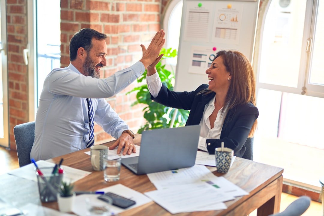 Two professionals working together during a collaborative meeting