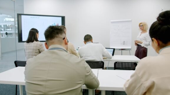University and education professionals attending a collaborative staff training workshop