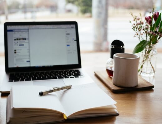 Laptop and notebook used for productivity planning and professional training