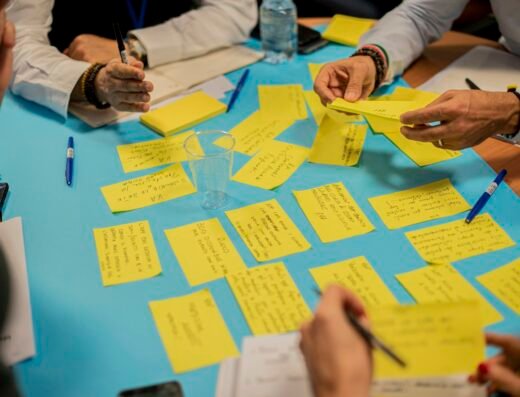 People brainstorming ideas using sticky notes during a creative storytelling workshop