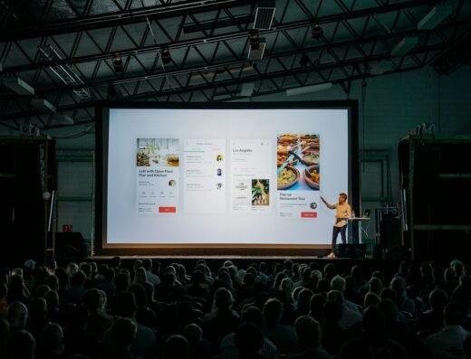 Speaker addressing an audience during a presentation