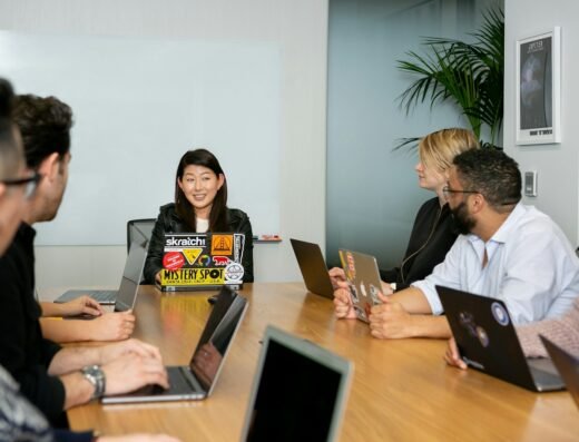 Colleagues exchanging ideas in a collaborative leadership workshop