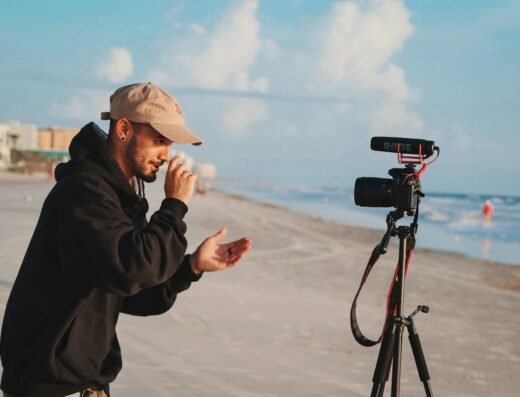Person filming video content with a camera outdoors